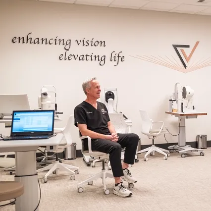 Dr. Rudd smiling in the exam room